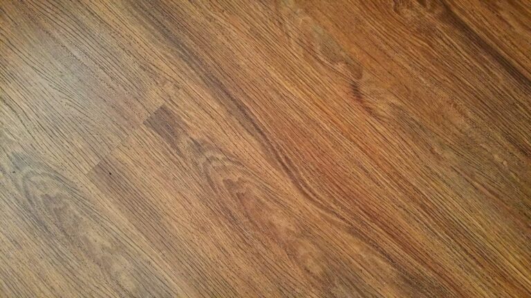 Detailed image of rustic wooden flooring with visible wood grain texture.